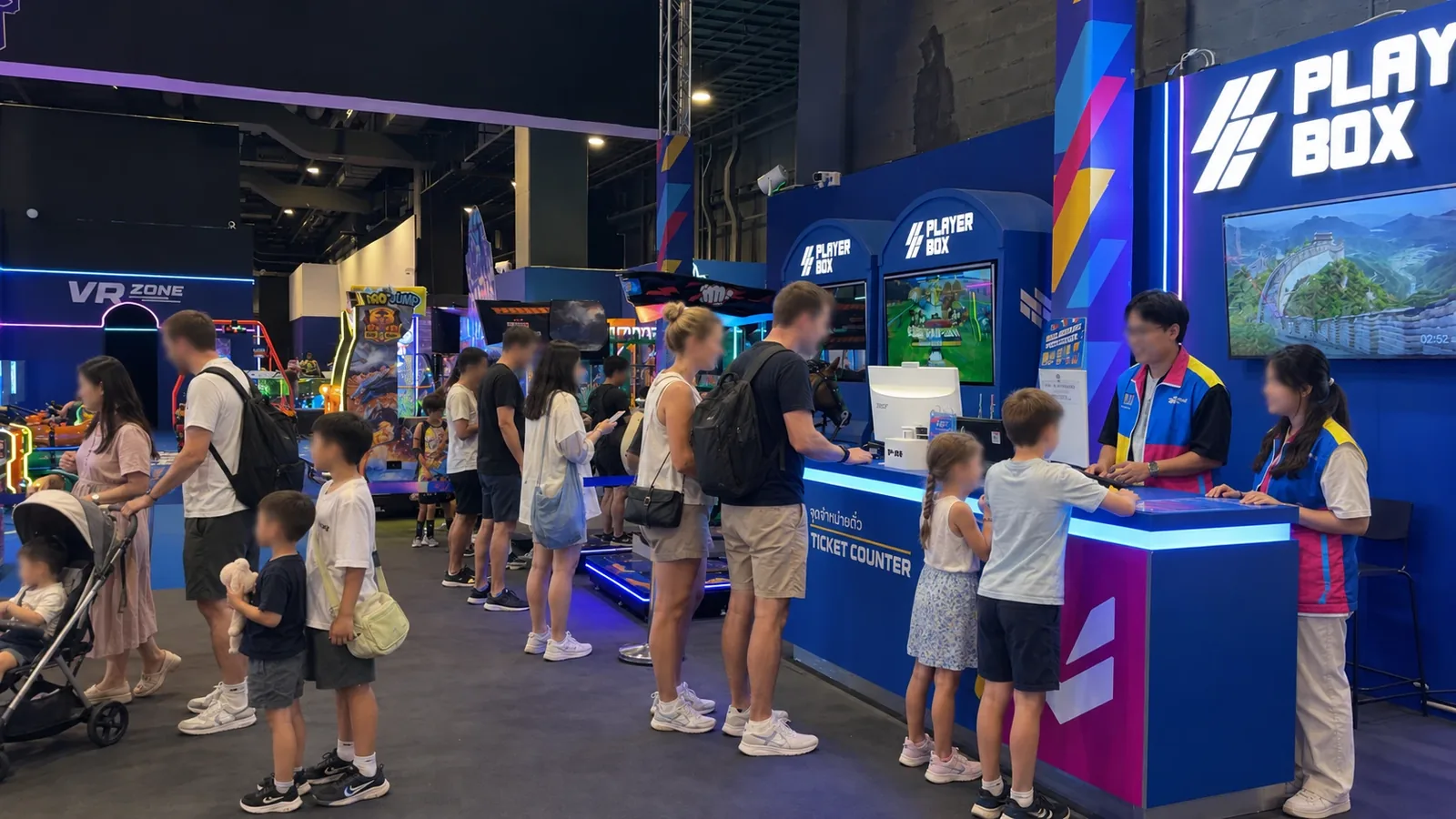 Guests at the ticket counter and arcade floor at Playerbox ICONSIAM